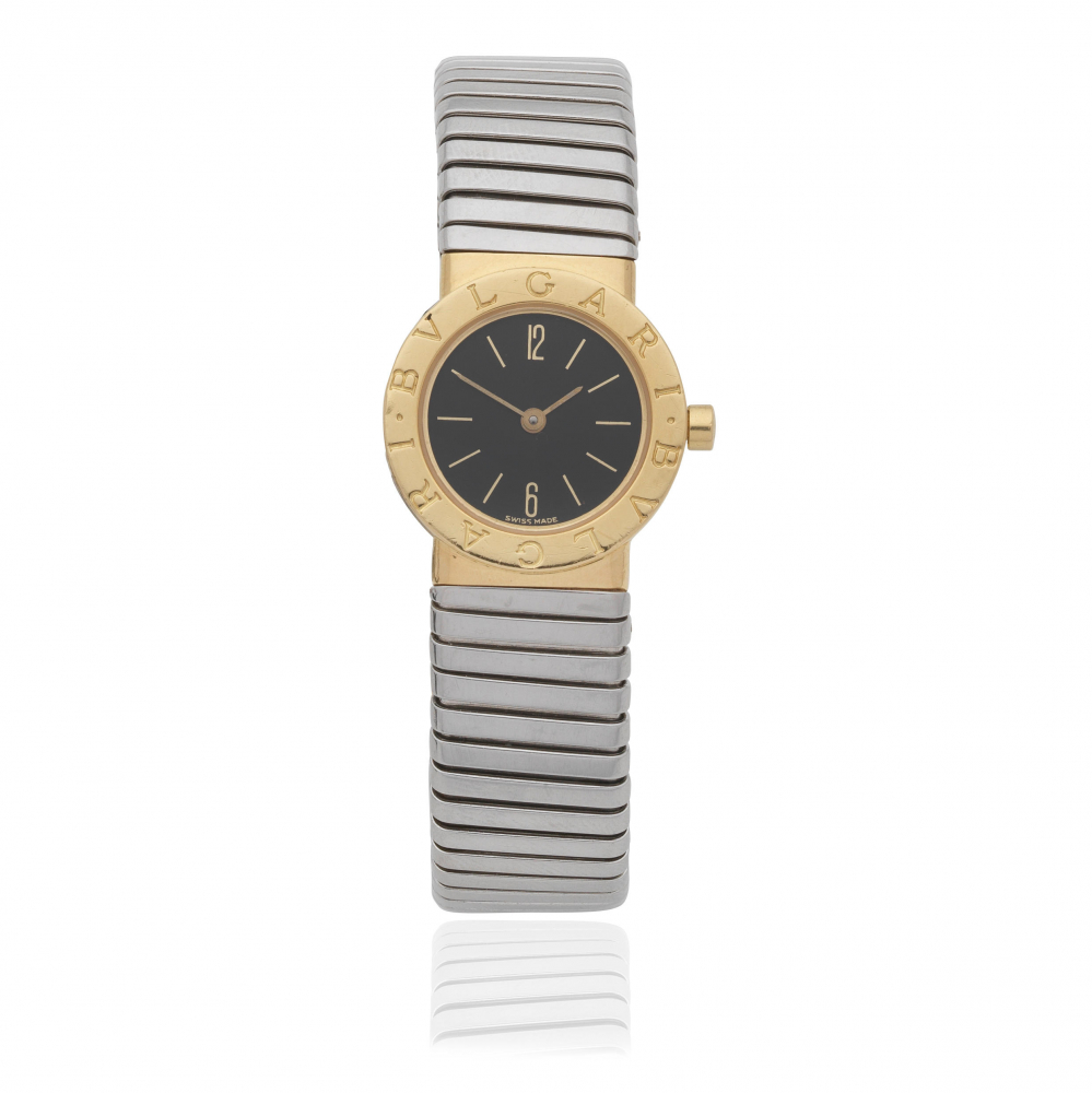 Bulgari. A lady's 18K gold and stainless steel bangle watch