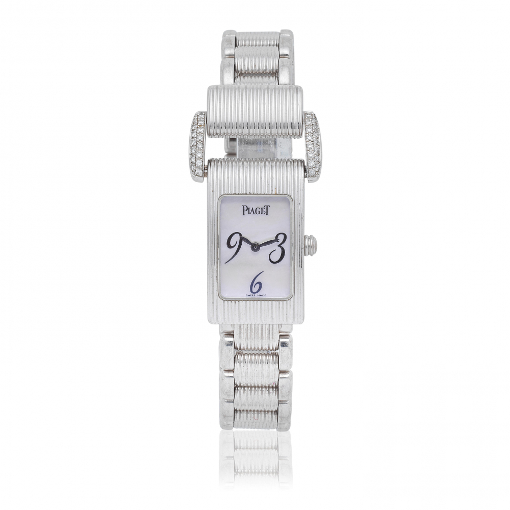 Piaget. A lady's 18K white gold and diamond set quartz bracelet watch with mother of pearl dial