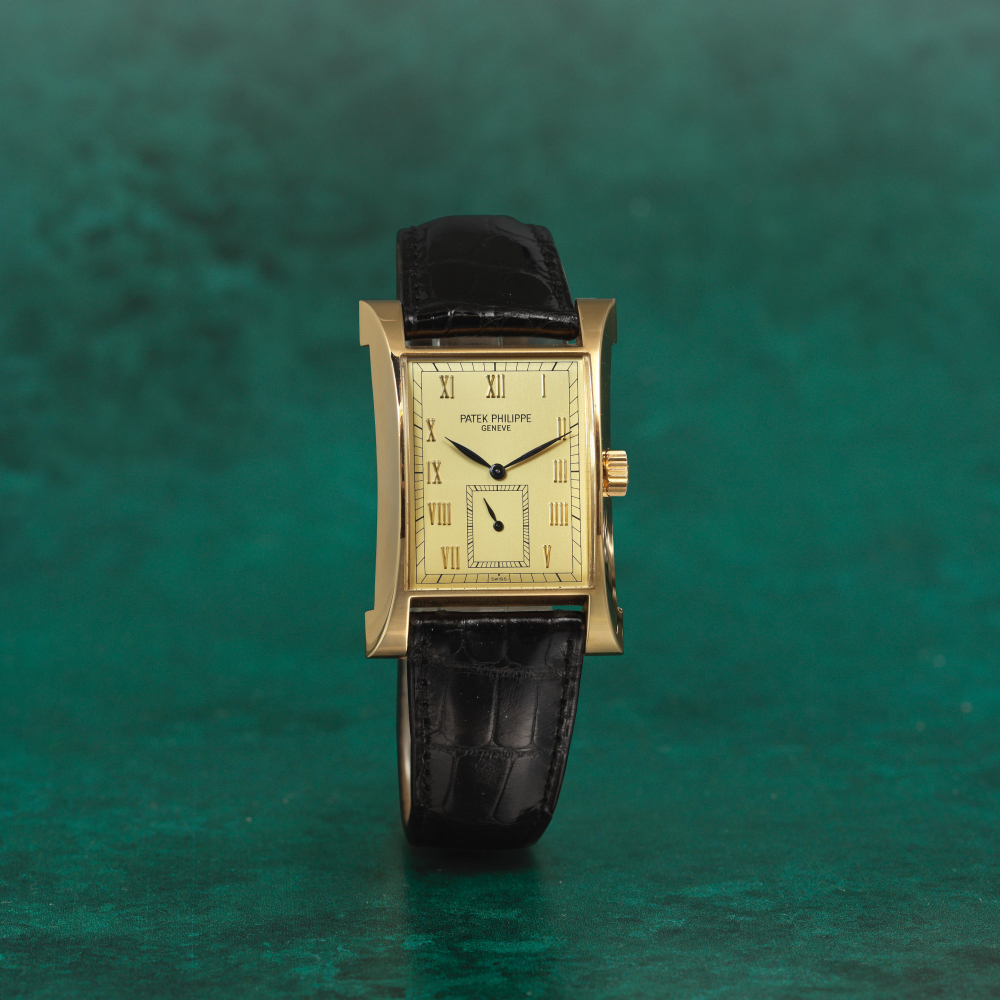 Patek Philippe. A fine and rare 18K gold manual wind commemoration wristwatch