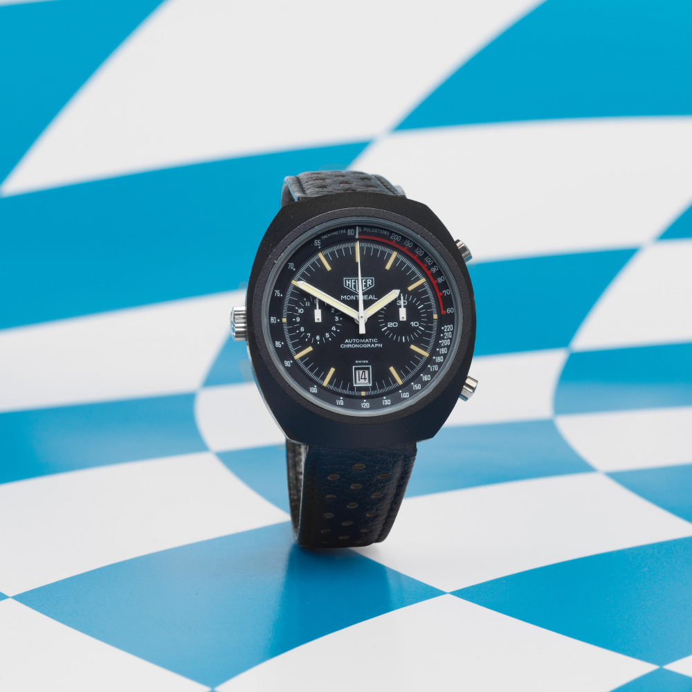 Heuer. A rare black PVD coated stainless steel automatic calendar chronograph wristwatch