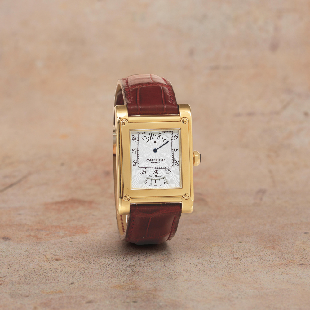 Cartier. A fine 18K gold manual wind calendar wristwatch with retrograde hours