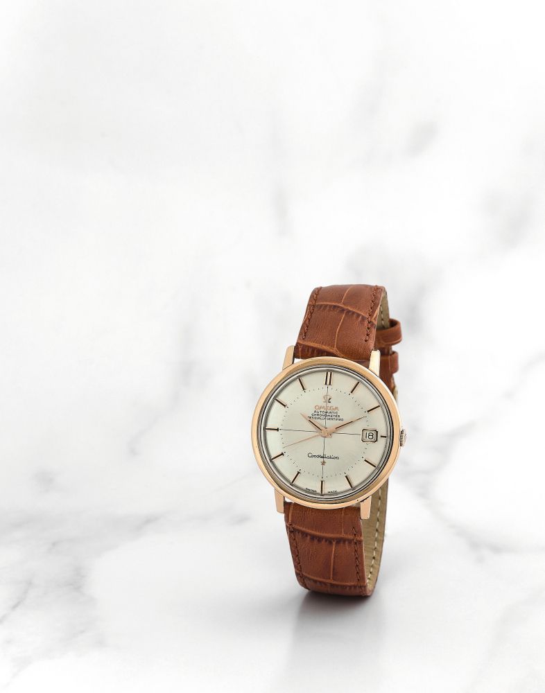 Omega. Montre bracelet en or rose 18K (750) avec date mouvement automatique