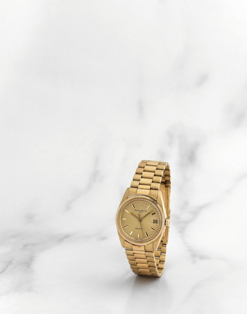 Baume Mercier. Montre bracelet en or jaune 18K (750) avec date mouvement automatique