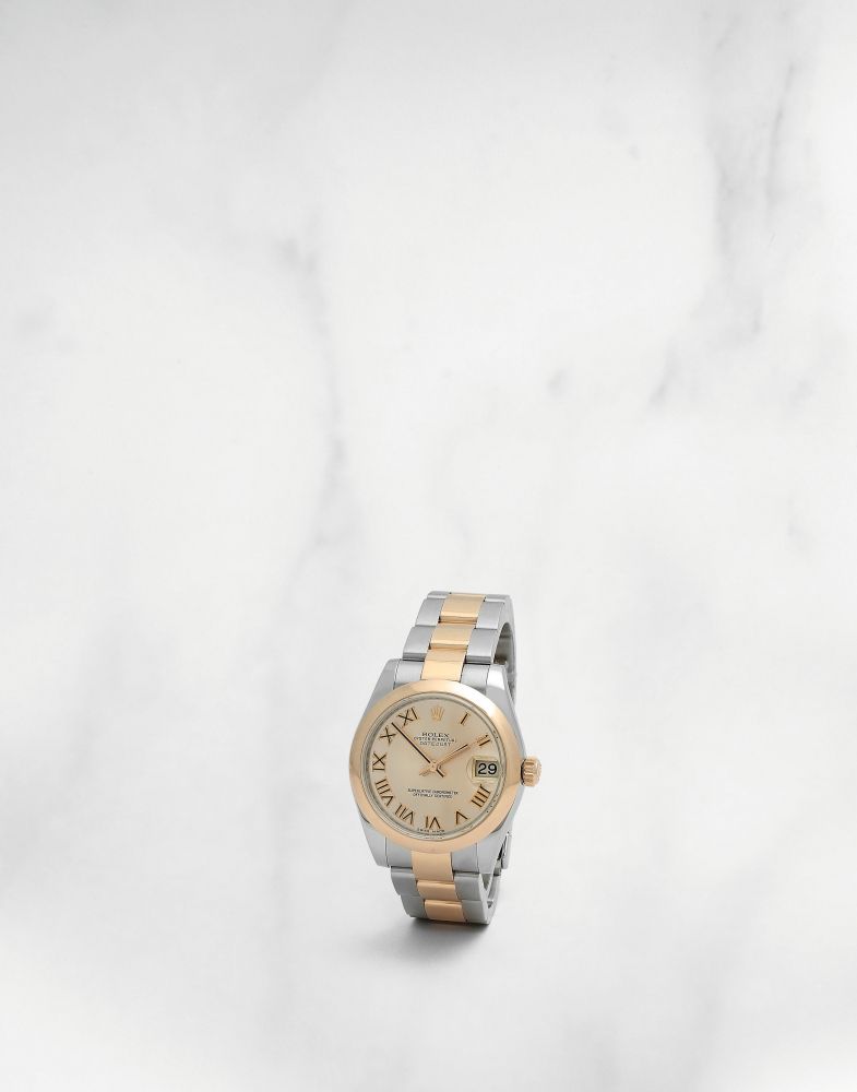 Rolex. Montre bracelet de taille medium en or rose 18K (750) et acier avec date mouvement automatique