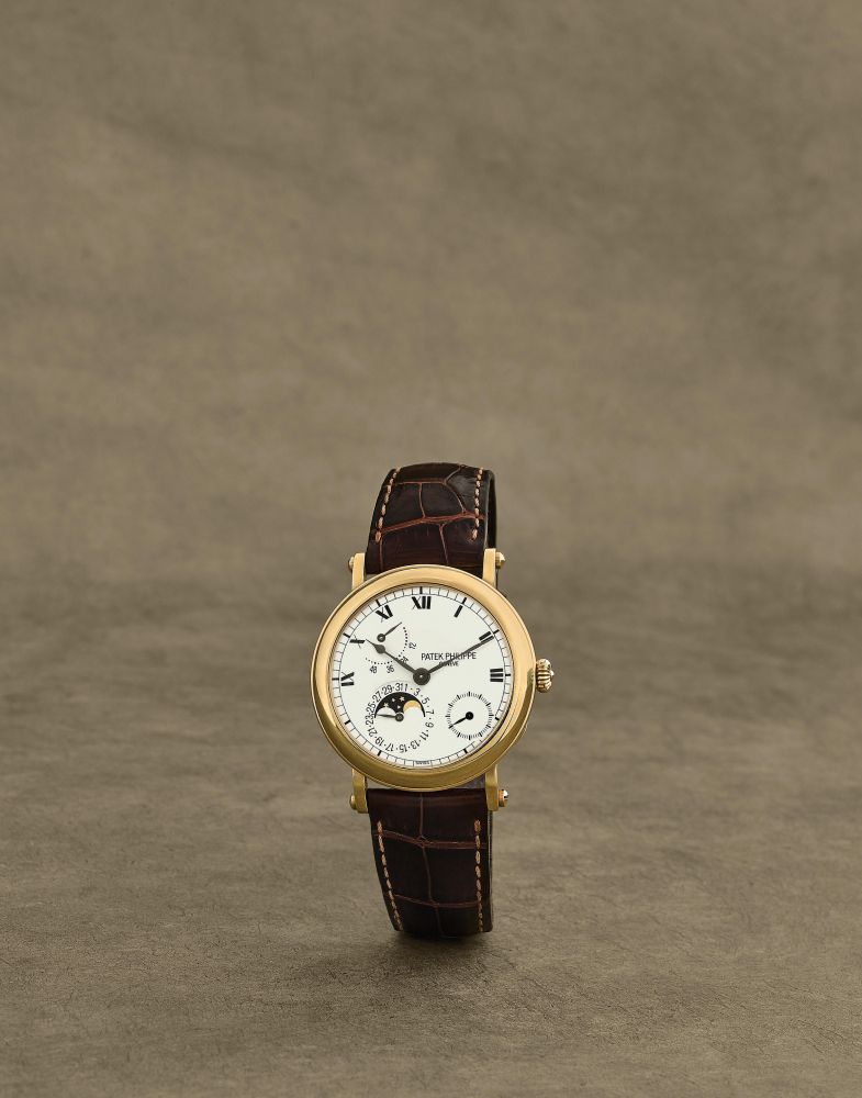 Patek Philippe. Chronographe bracelet en or jaune 18K (750) avec date phase de lune et reserve de marche mouvement automatique