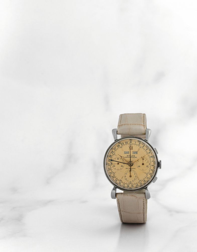 Rolex. Beau chronographe bracelet en acier triple calendrier mouvement mécanique
