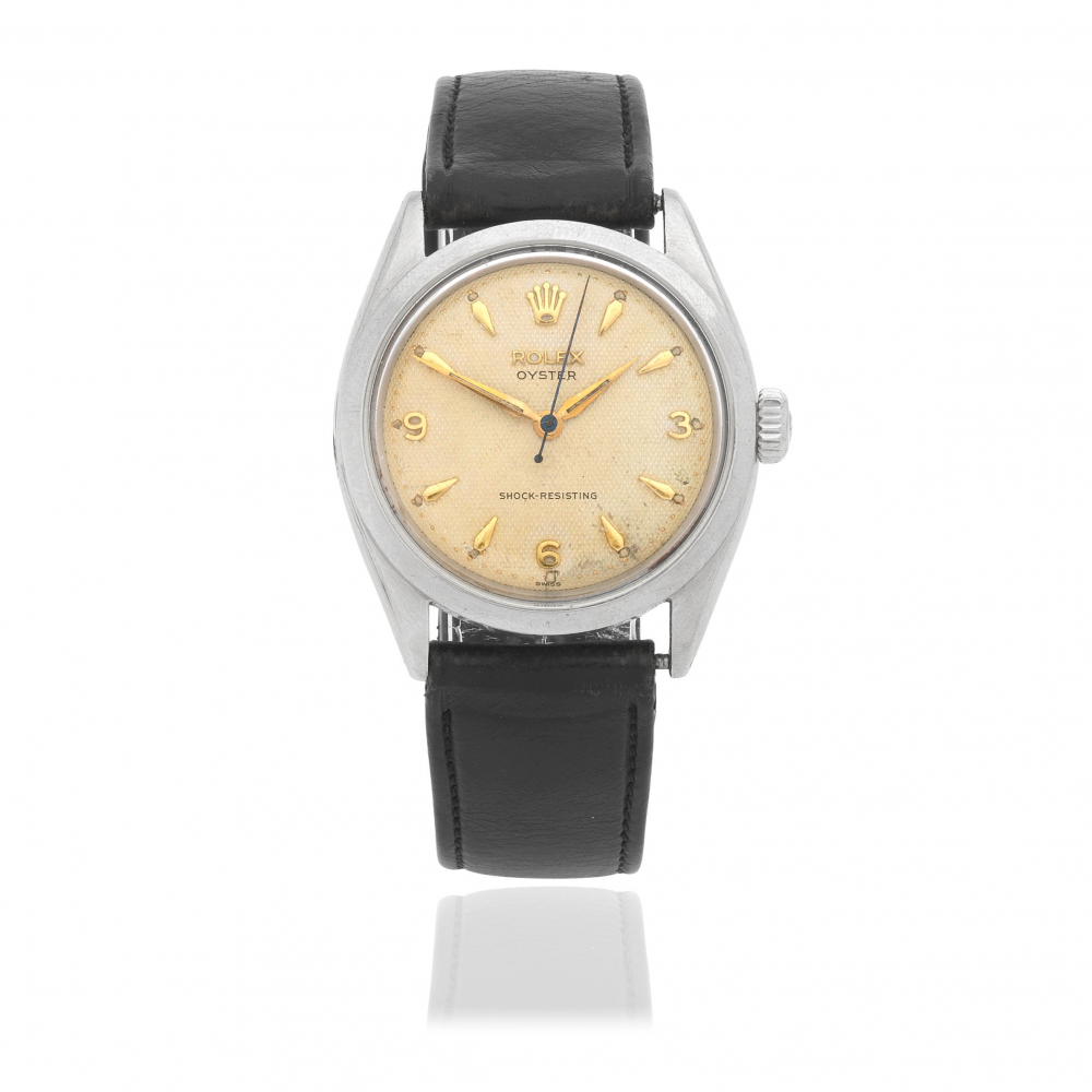 Rolex. A stainless steel manual wind wristwatch