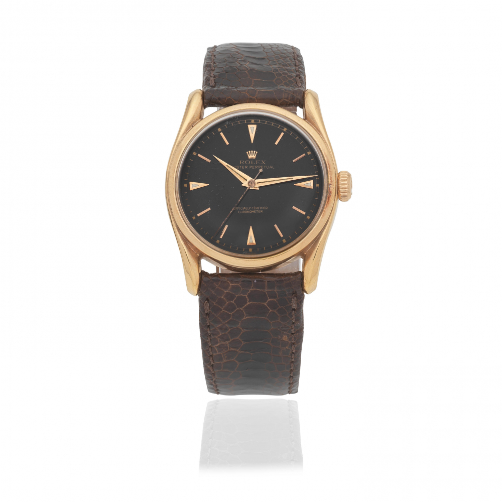 Rolex. An 18K gold automatic wristwatch