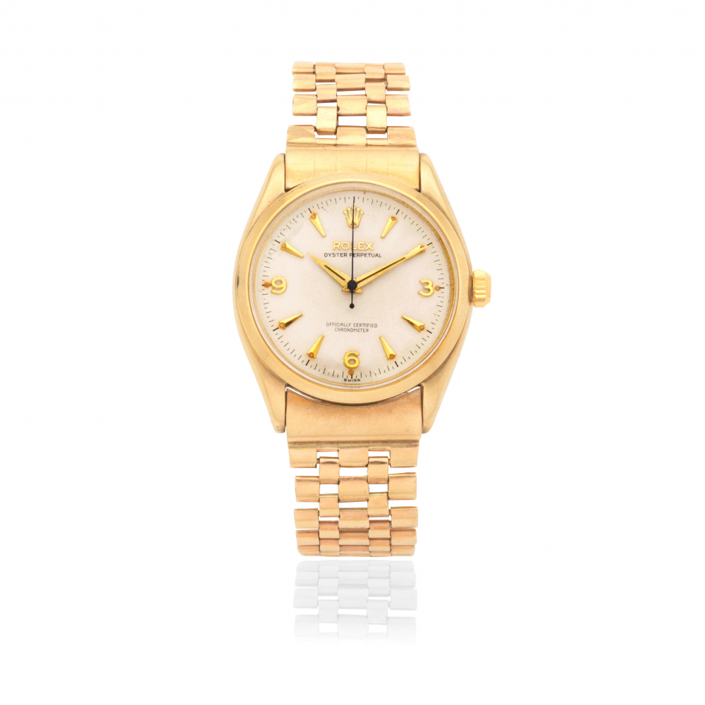 Rolex. A 9K gold automatic bracelet watch