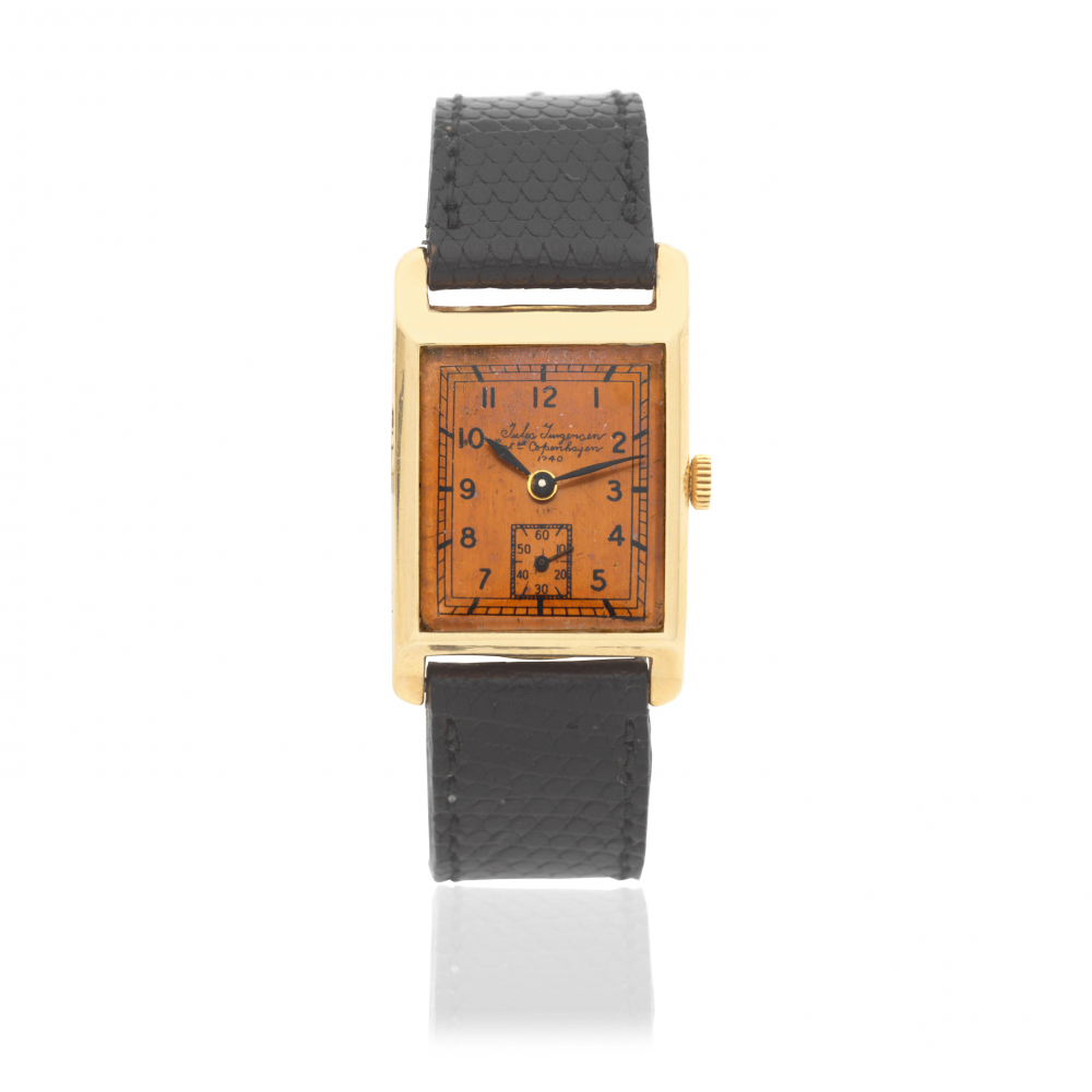 Jules Jurgensen. A 14K gold manual wind rectangular wristwatch