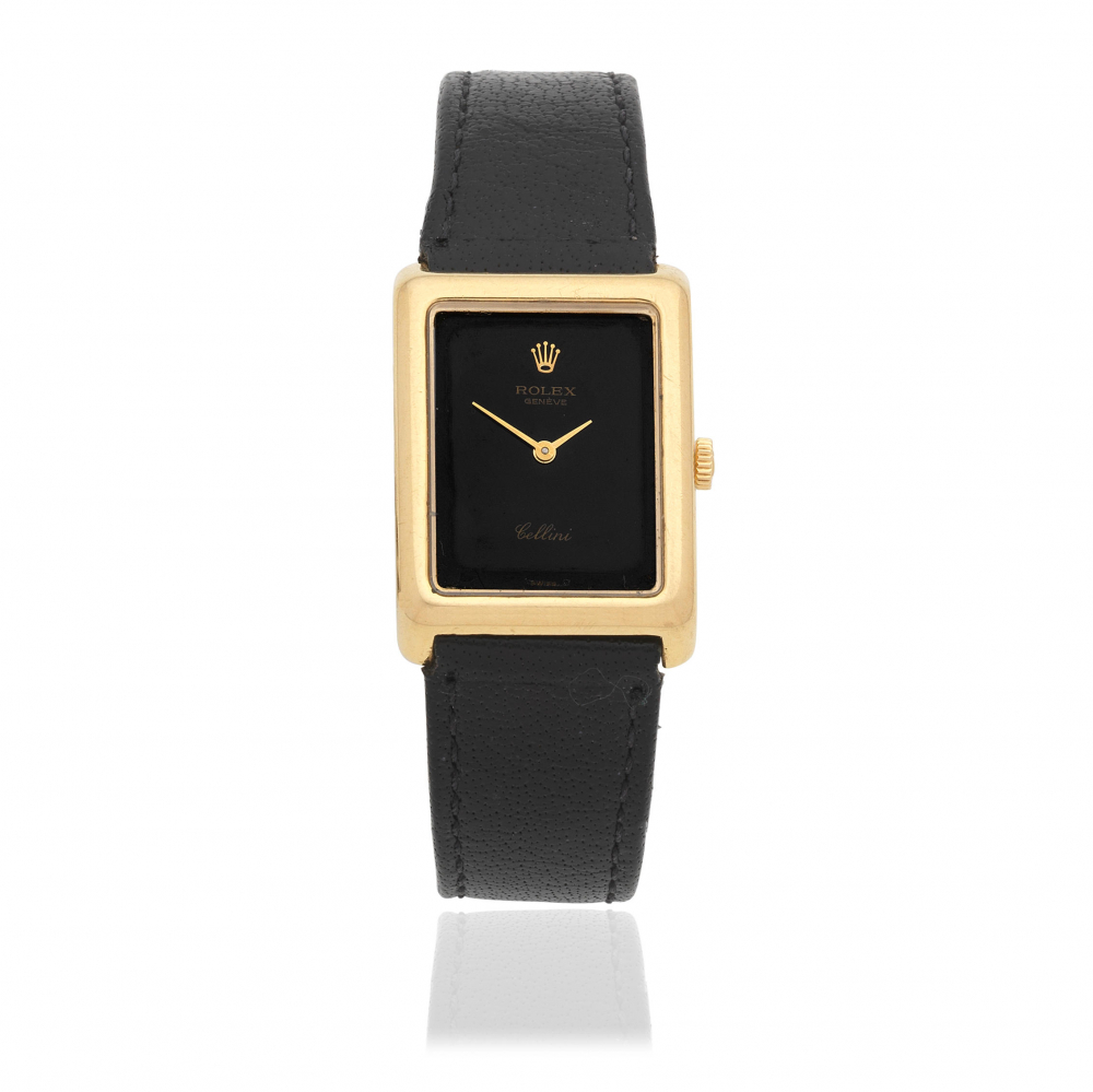 Rolex. A lady's 18K gold manual wind rectangular wristwatch