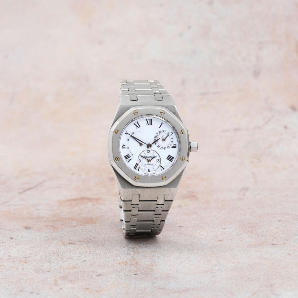 Audemars Piguet. A fine and rare stainless steel automatic calendar bracelet watch with power reserve and "porcelain" dial