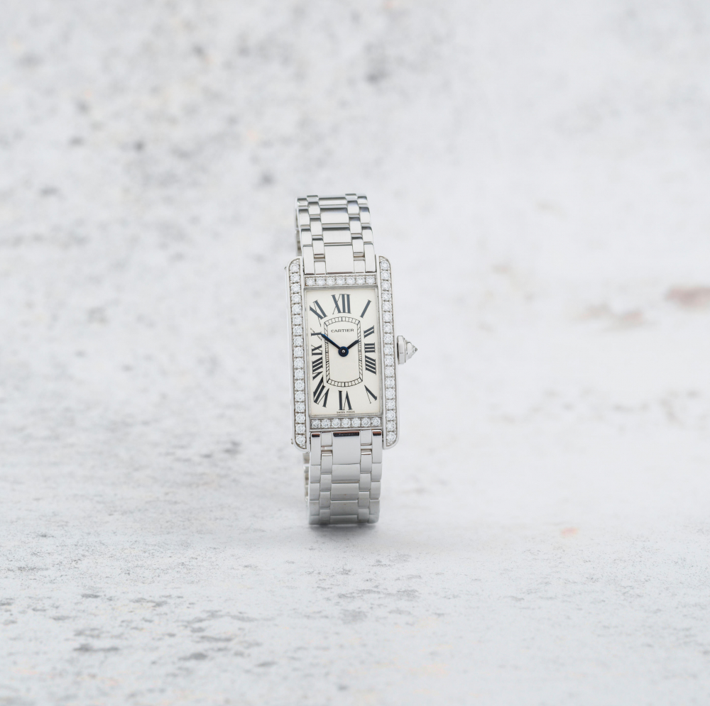 Cartier. A lady's 18K white gold diamond set quartz bracelet watch
