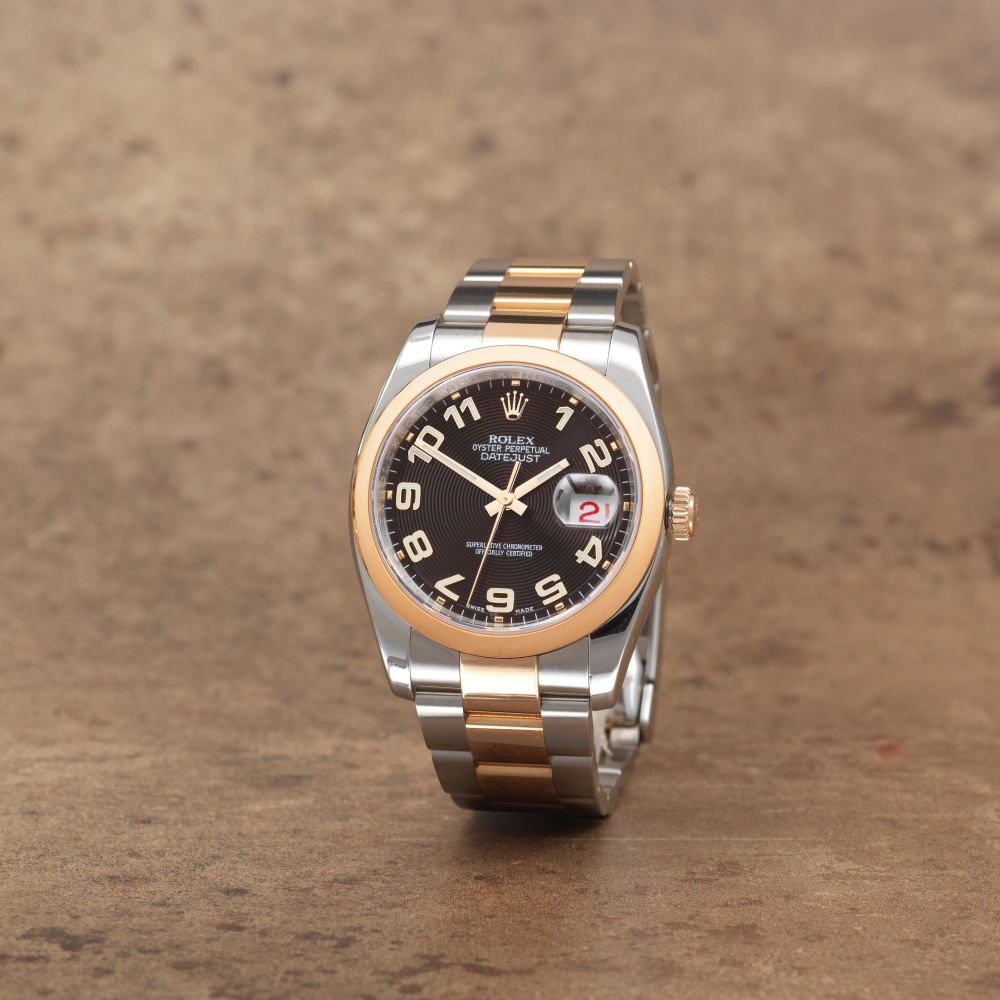 Rolex. A stainless steel and rose gold automatic calendar bracelet watch with roulette date wheel