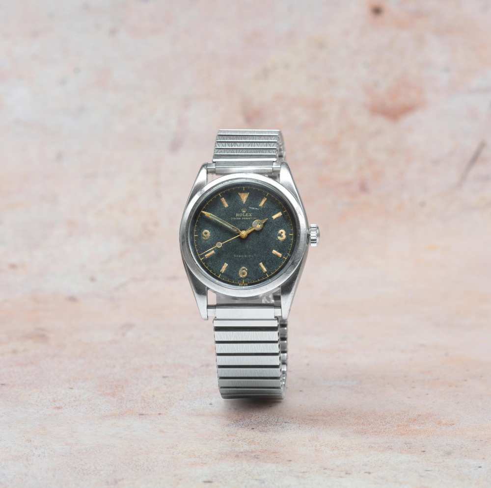 Rolex. A fine and rare stainless steel automatic bracelet watch with gilt dial