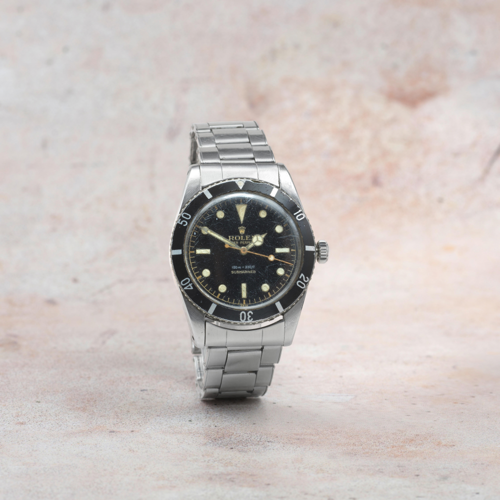 Rolex. A stainless steel automatic bracelet watch with gilt gloss dial