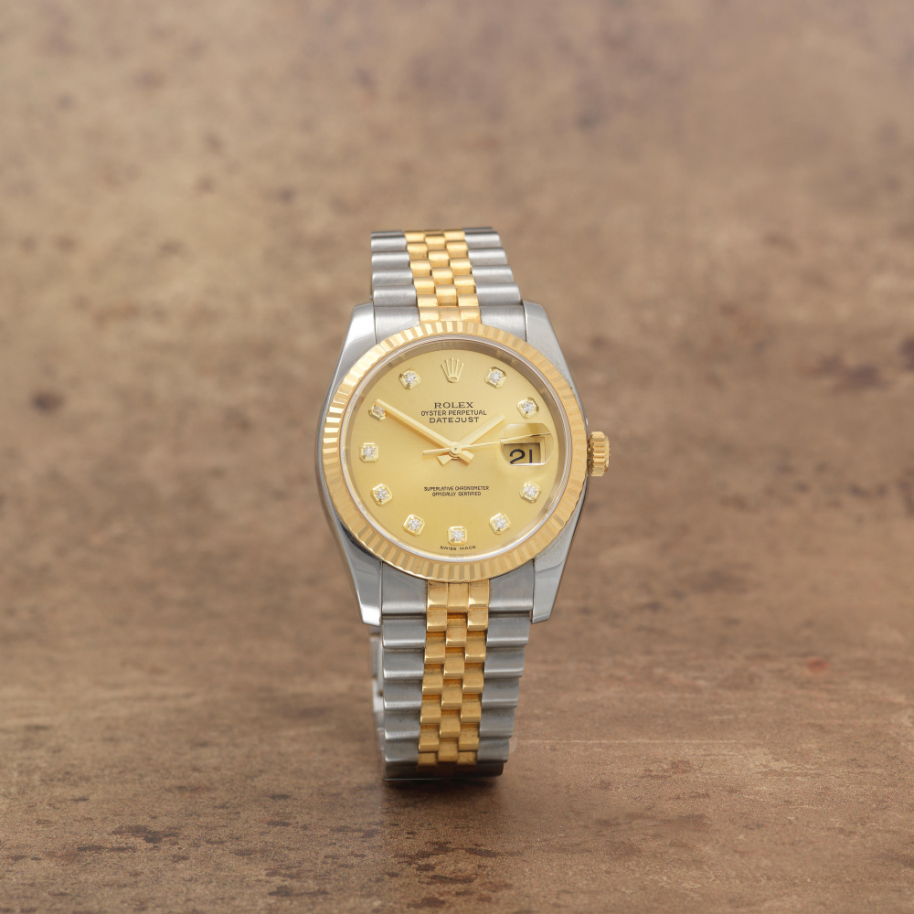 Rolex. A stainless steel and gold diamond set automatic calendar bracelet watch
