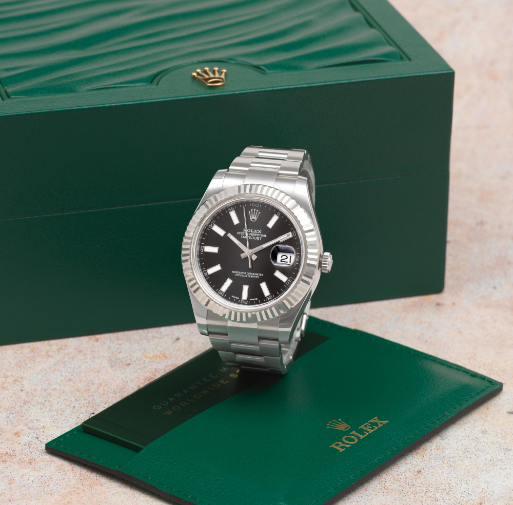 Rolex. A stainless steel and white gold automatic calendar bracelet watch