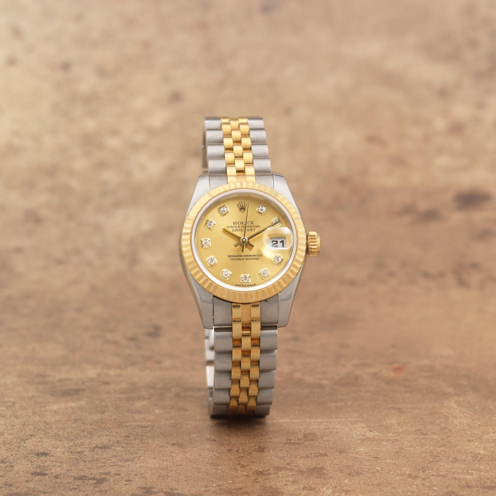 Rolex. A lady's stainless steel and 18K gold diamond set automatic calendar bracelet watch