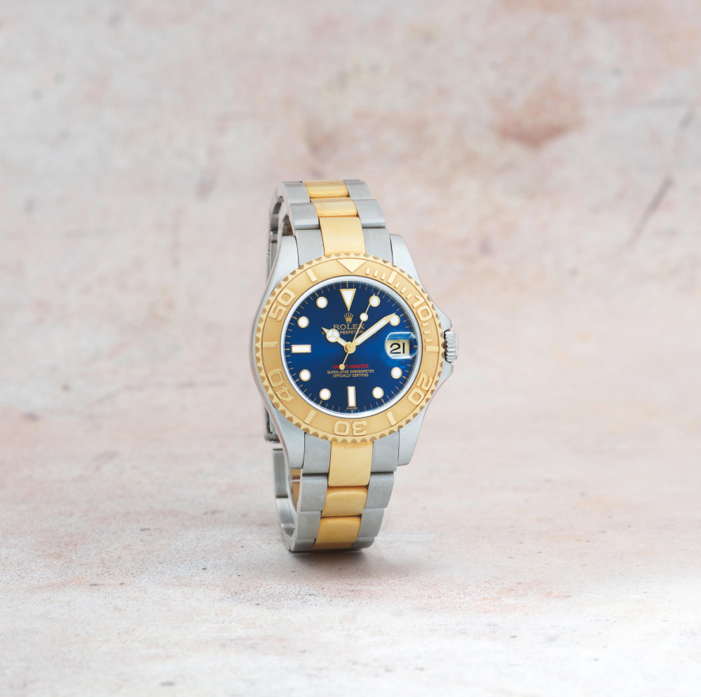 Rolex. A lady's stainless steel and gold automatic calendar bracelet watch