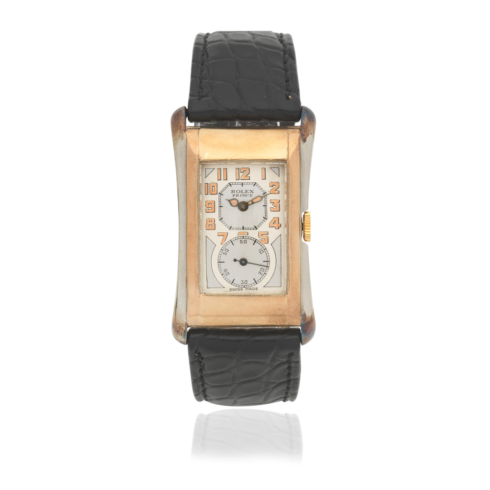Rolex. A 9K gold and silver manual wind rectangular wristwatch