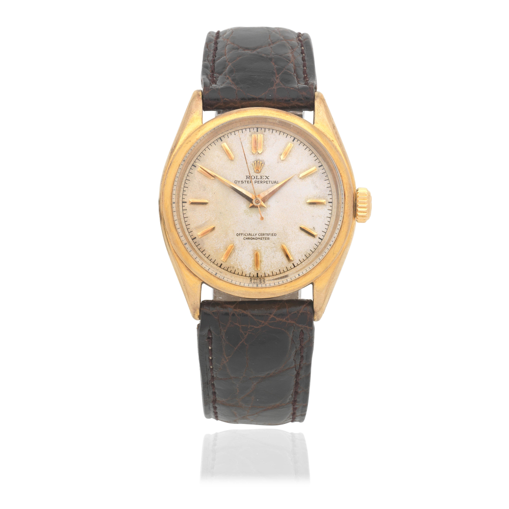 Rolex. A 9K gold automatic wristwatch