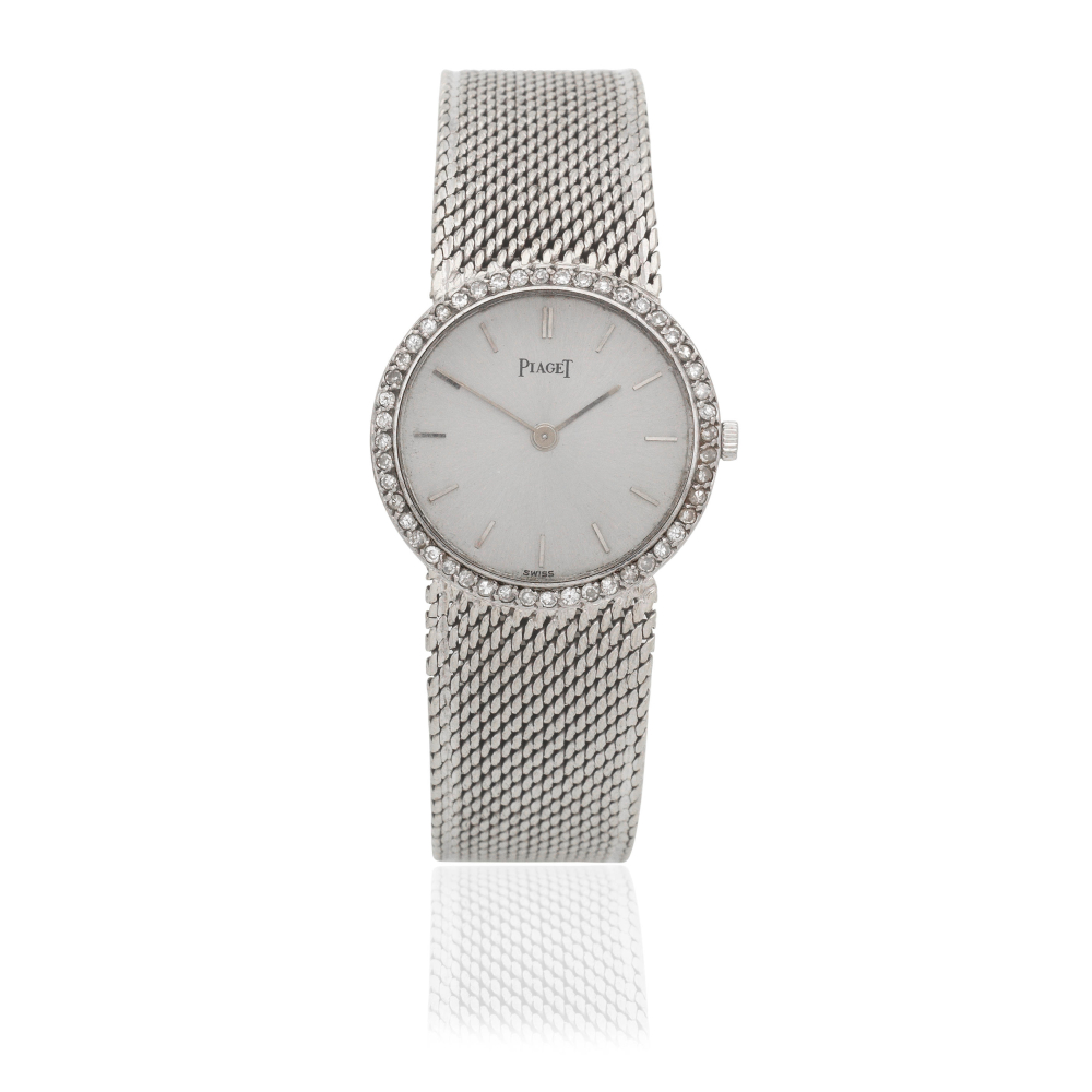 Piaget. A lady's 18K white gold diamond set manual wind bracelet watch