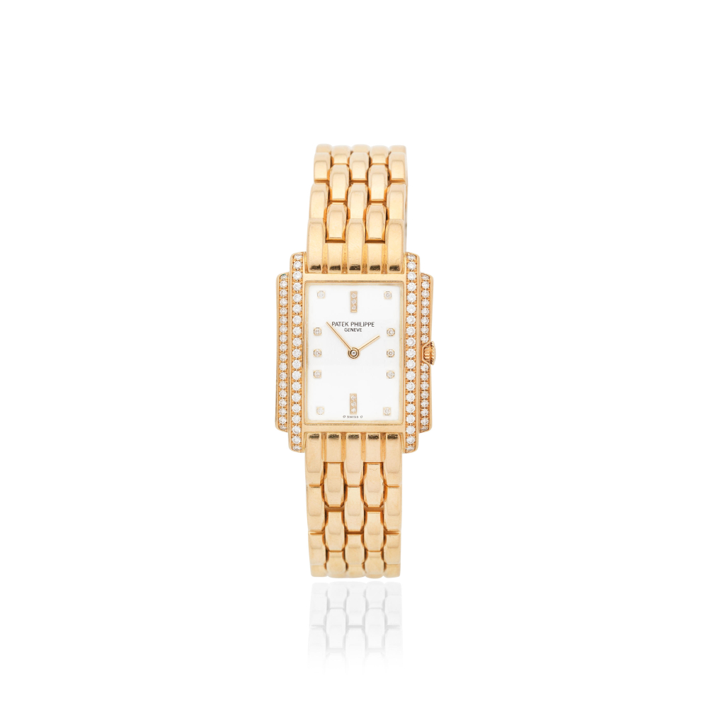 Patek Philippe. A lady's 18K gold diamond set quartz bracelet watch with sigma dial