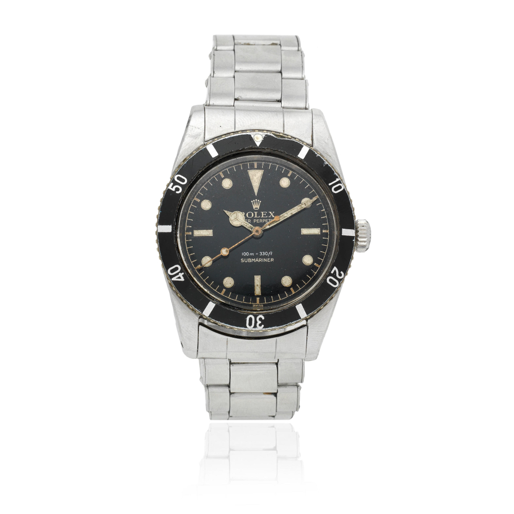 Rolex. A stainless steel automatic bracelet watch with gilt gloss dial
