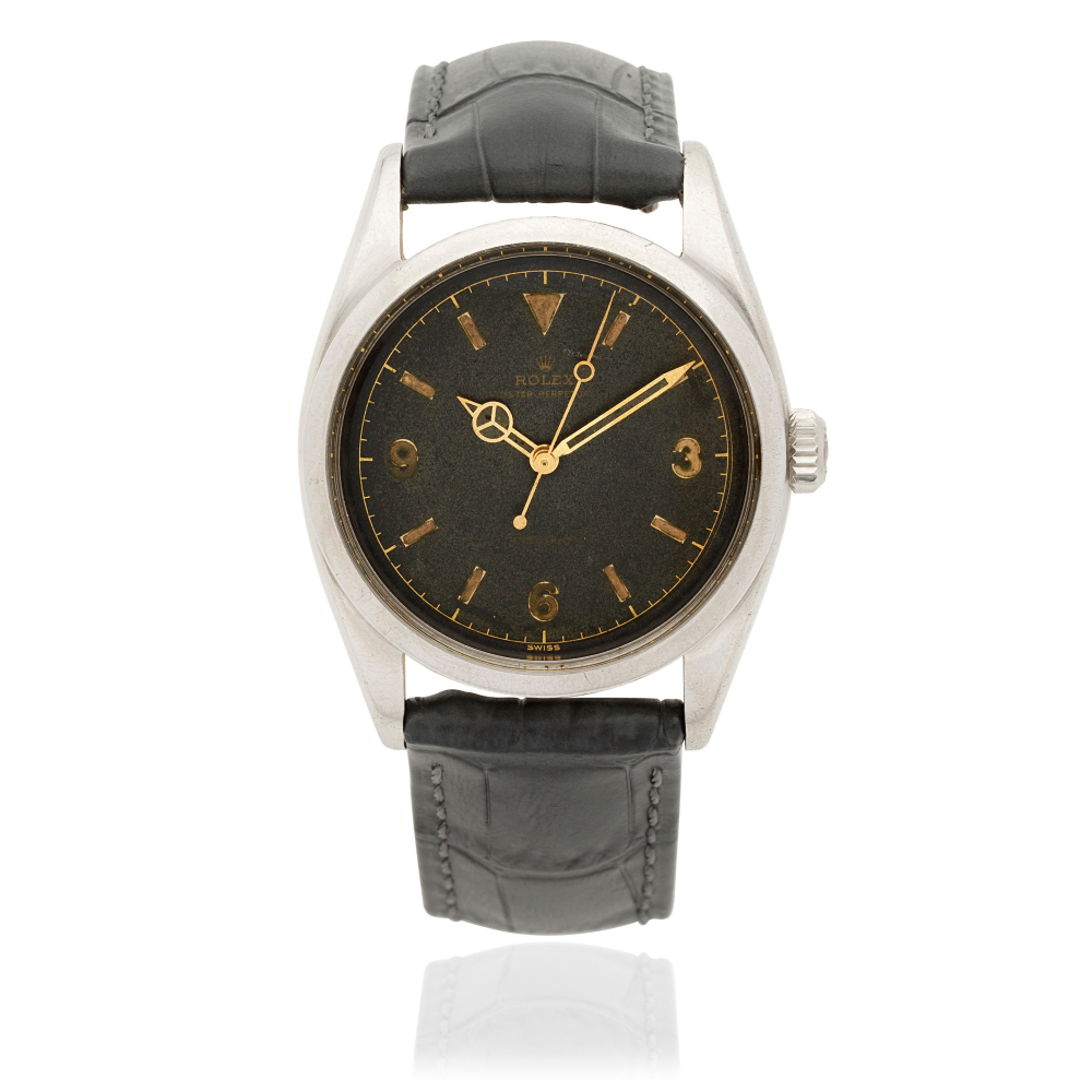 Rolex. A fine and rare stainless steel automatic wristwatch with gilt dial