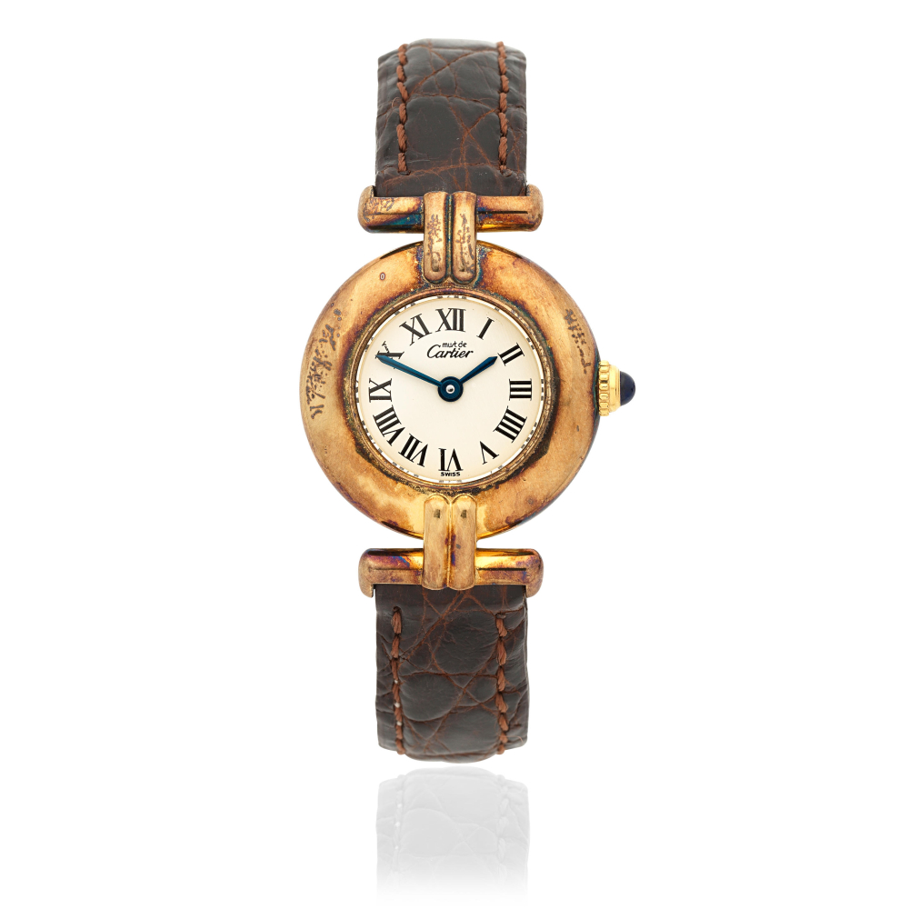 Cartier. A lady's gold plated silver quartz wristwatch