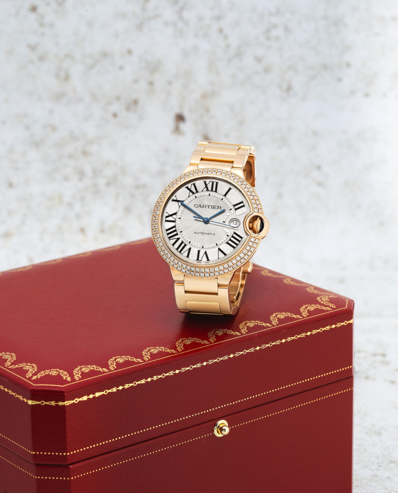 Cartier. A fine 18K gold diamond set automatic calendar bracelet watch