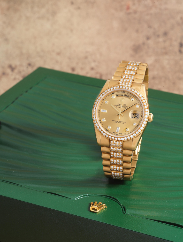 Rolex. A fine 18K gold diamond set automatic calendar bracelet watch