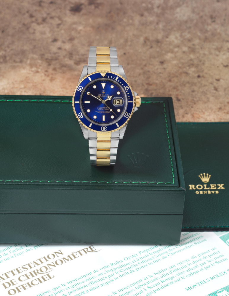 Rolex. A fine stainless steel and gold automatic calendar bracelet watch