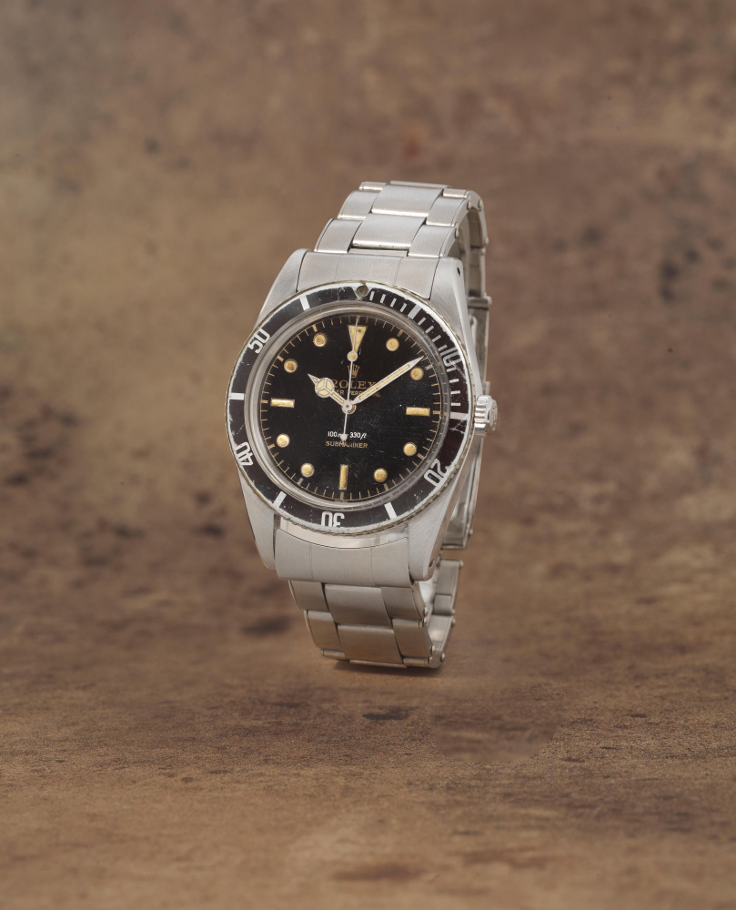 Rolex. A fine and rare stainless steel automatic bracelet watch with gilt dial
