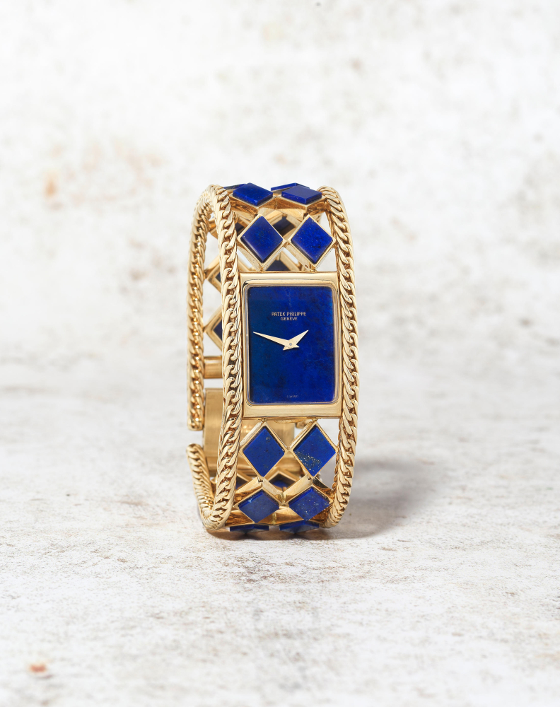 Patek Philippe. A fine and rare lady's 18K gold and lapis lazuli manual wind bracelet watch
