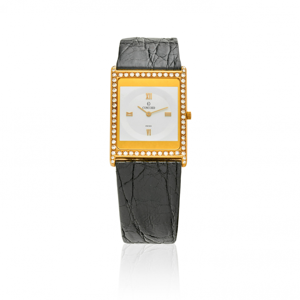 CONCORD. AN 18K GOLD AND DIAMOND SET THIN RECTANGULAR WRISTWATCH