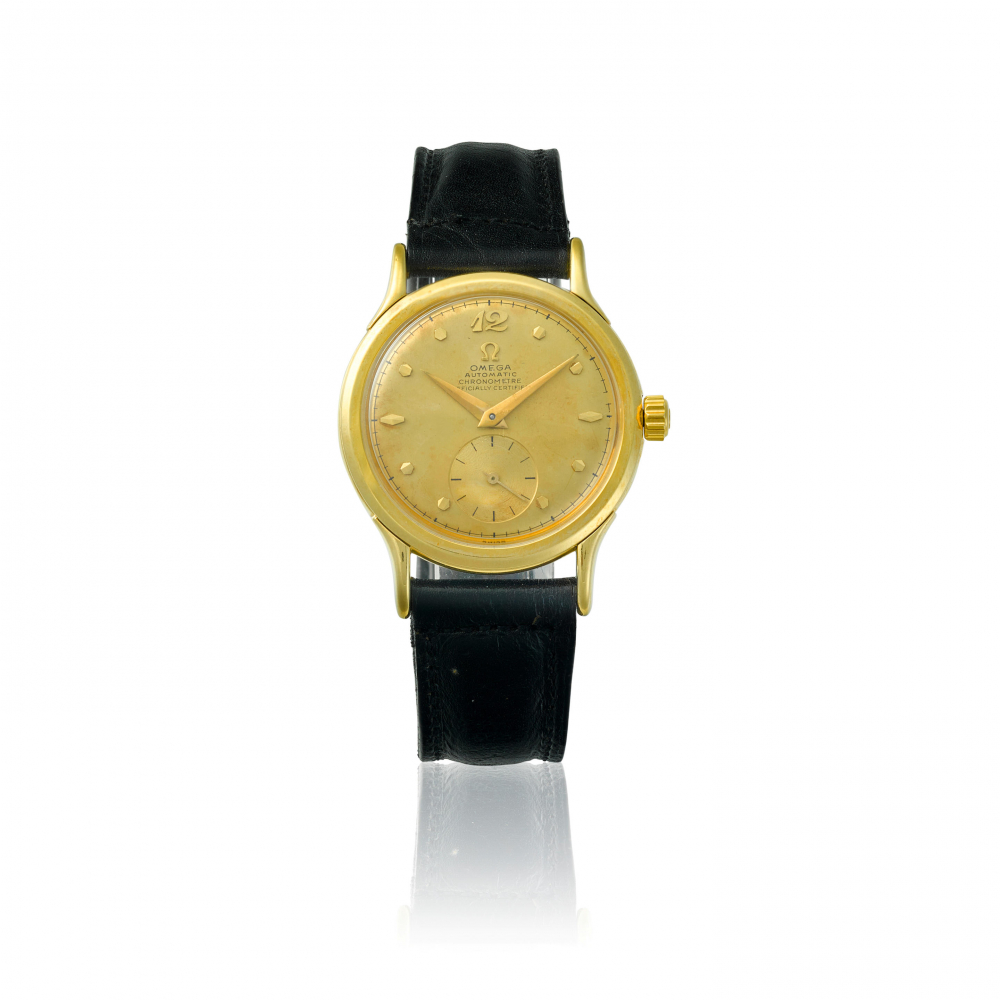 OMEGA. AN 18K GOLD AUTOMATIC BUMPER WRISTWATCH
