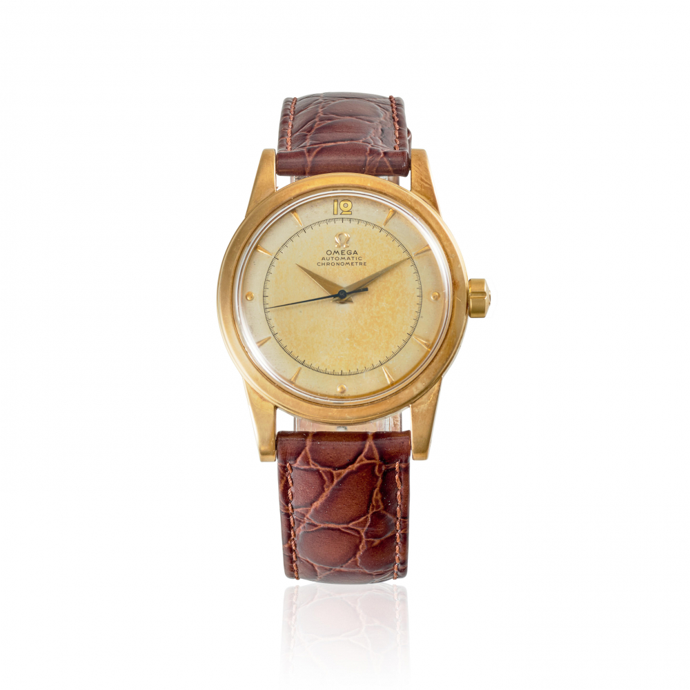 OMEGA. A 14K GOLD AUTOMATIC BUMPER WRISTWATCH