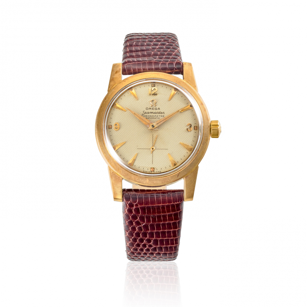 OMEGA. A 14K GOLD AUTOMATIC BUMPER WRISTWATCH