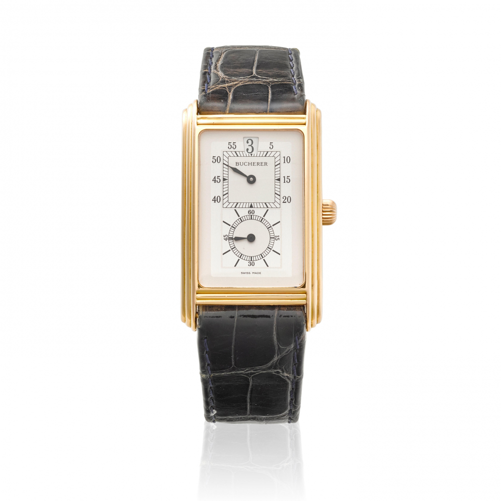 BUCHERER. AN 18K GOLD MANUAL WIND JUMP HOUR WRISTWATCH