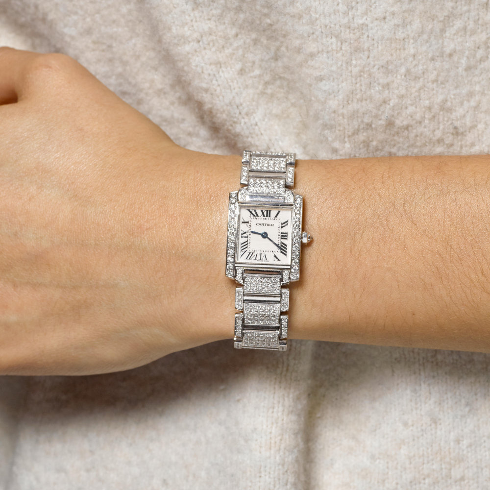 CARTIER. A FINE 18K WHITE GOLD AND DIAMOND TANK BRACELET WATCH