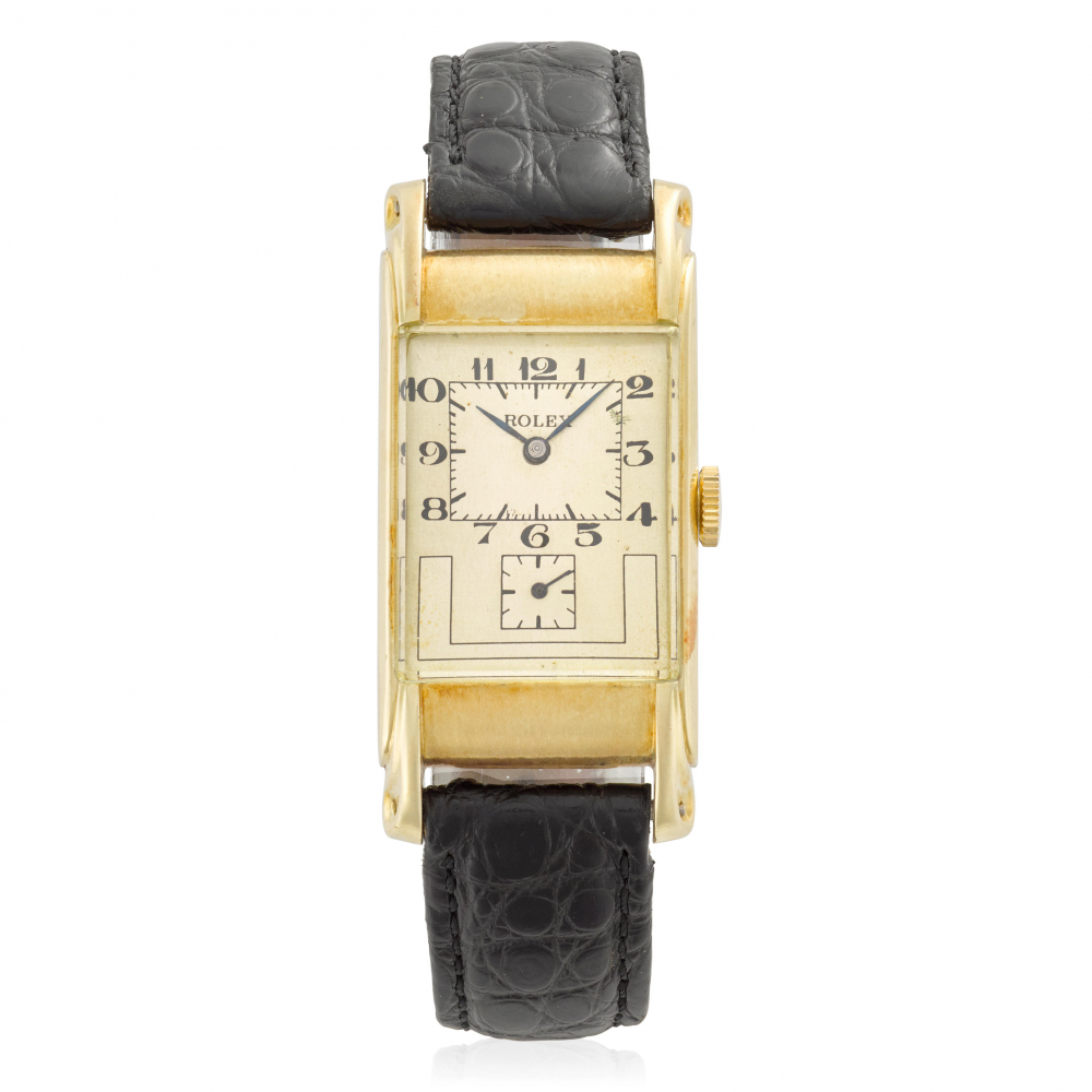 ROLEX. A 14K GOLD MANUAL WIND RECTANGULAR WRISTWATCH