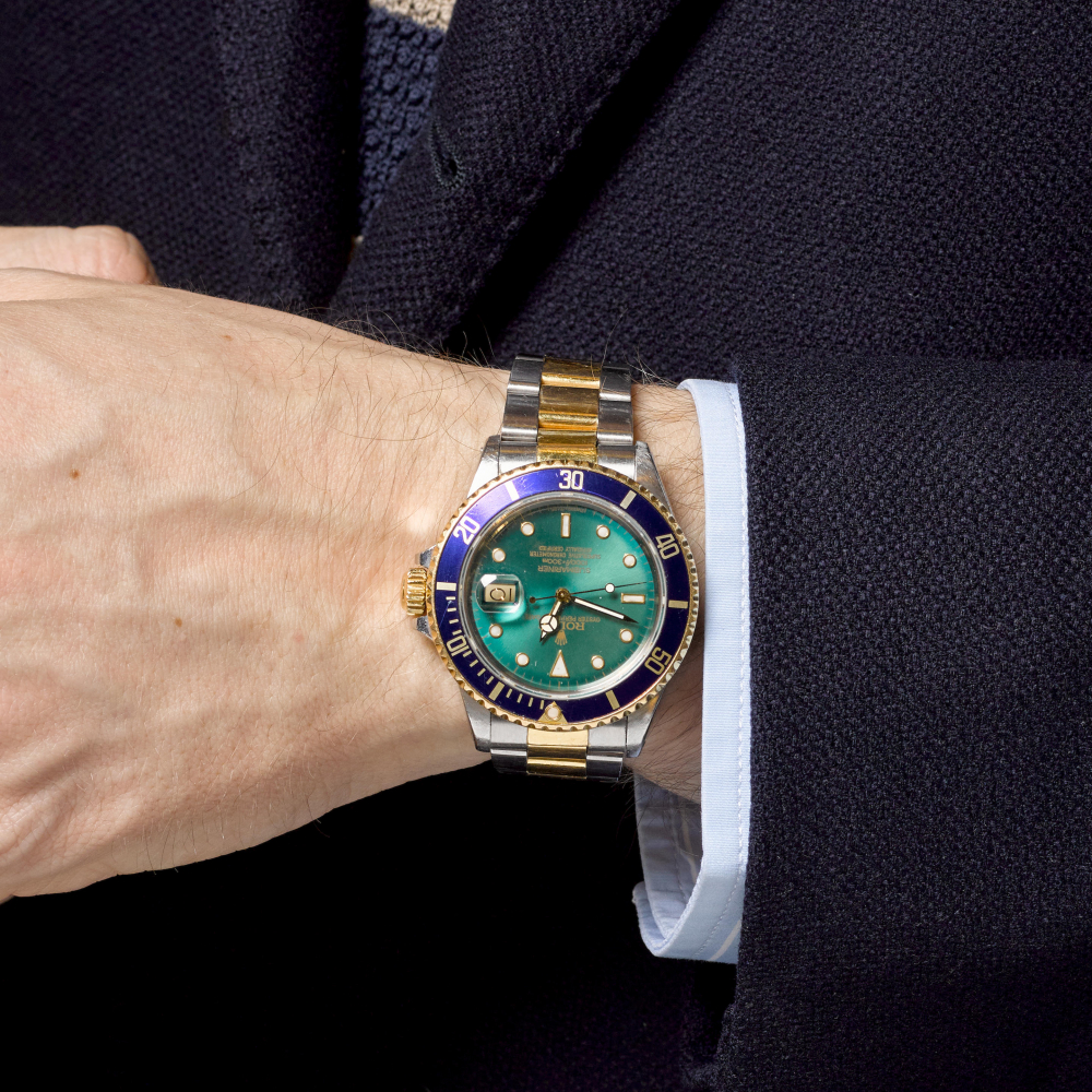 ROLEX. A STAINLESS STEEL AND GOLD AUTOMATIC CALENDAR BRACELET WATCH WITH GREEN TROPICAL DIAL