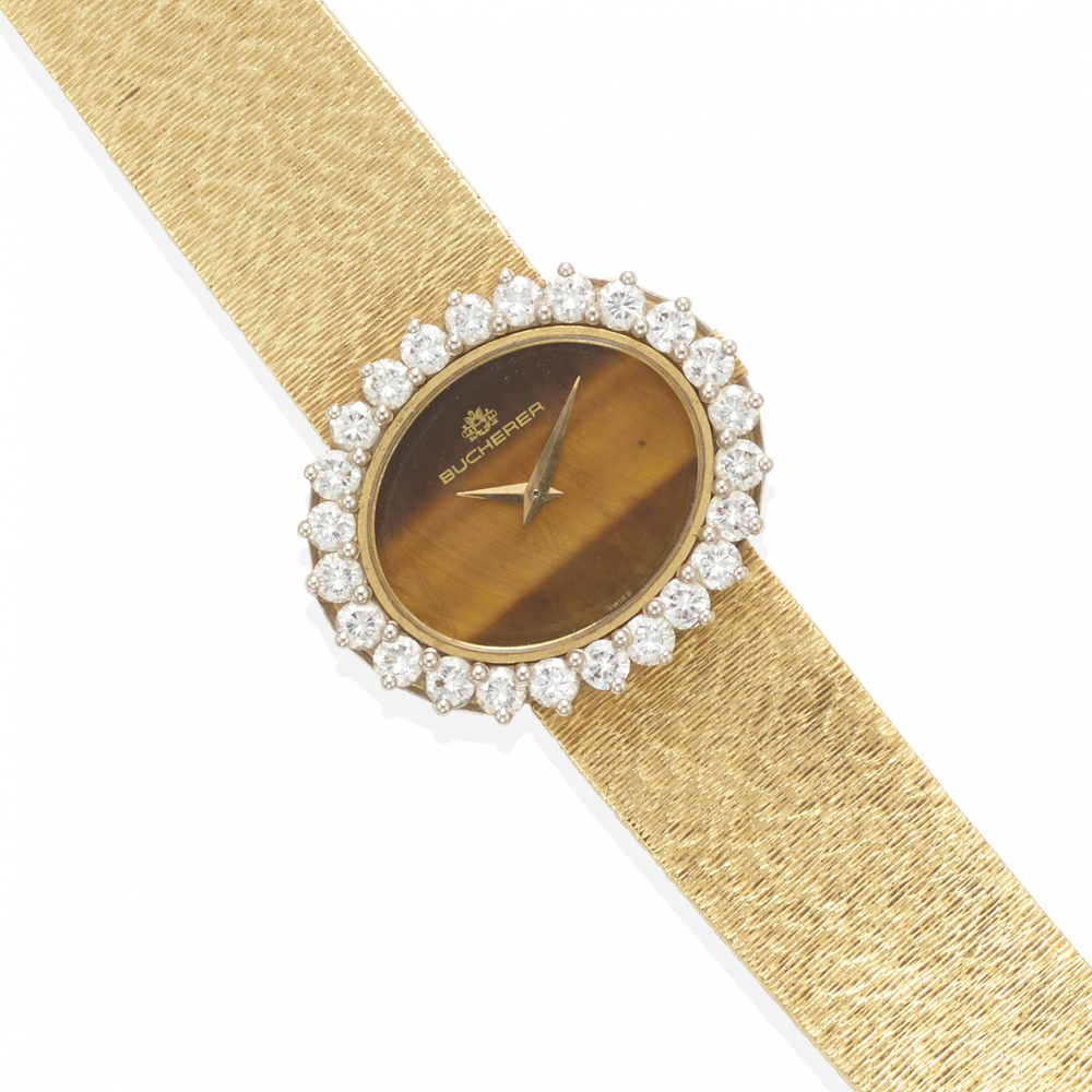 BUCHERER: AN 18K BI-COLOR GOLD, TIGER'S EYE QUARTZ AND DIAMOND WRISTWATCH