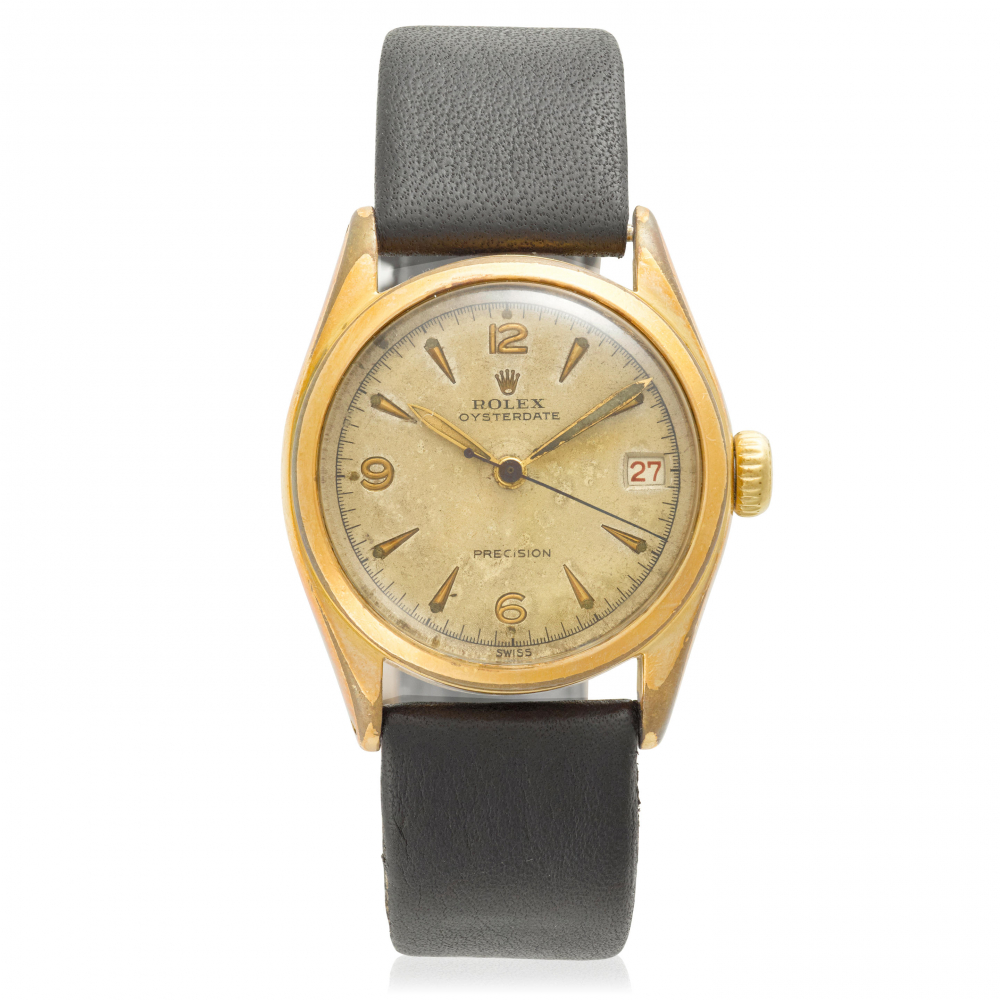 ROLEX. A GOLD PLATED AND STAINLESS STEEL MANUAL WIND WRISTWATCH WITH RED DATE