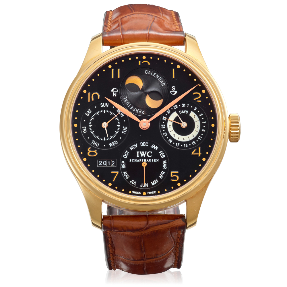 IWC. AN 18K GOLD AUTOMATIC PERPETUAL CALENDAR WRISTWATCH WITH MOON PHASE AND POWER RESERVE INDICATION