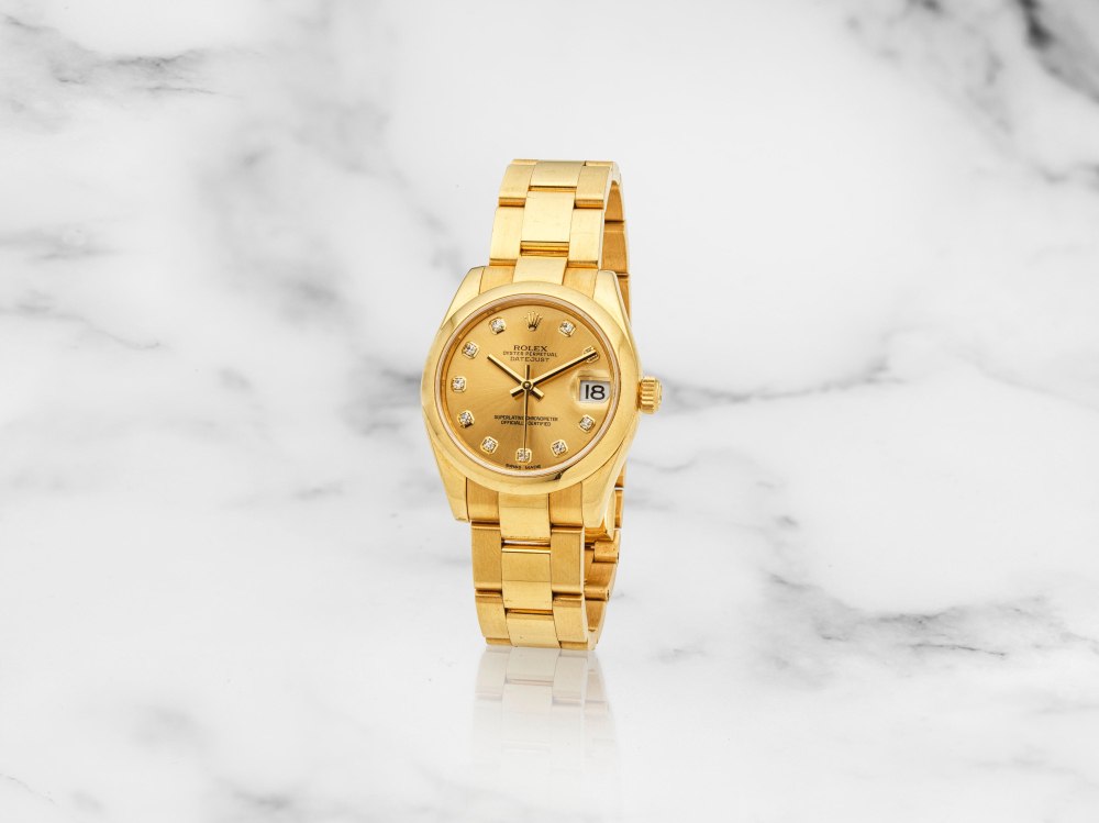 Rolex. Montre bracelet de dame en or jaune 18K (750) avec date mouvement automatique
