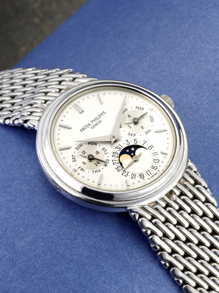 PATEK PHILIPPE | GRAND COMPLICATIONS, REF.3945/1G, AN EXTREMELY RARE WHITE GOLD PERPETUAL CALENDAR BRACELET WATCH WITH MOON PHASES AND LEAP YEAR DISPLAY, CIRCA 1988