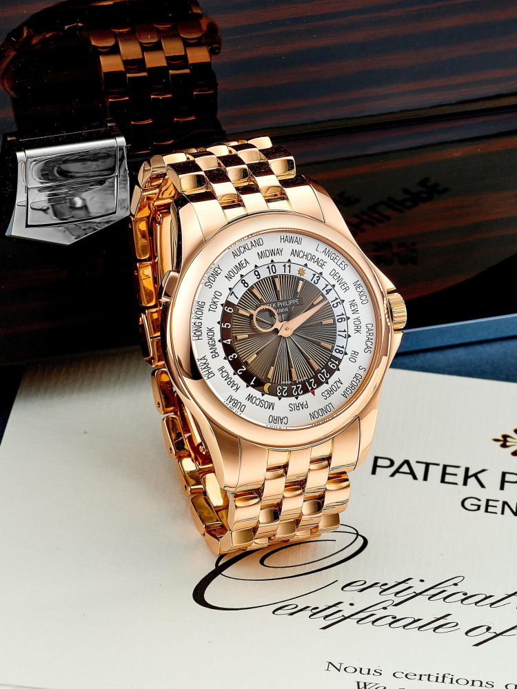 PATEK PHILIPPE | WORLD TIME, REF.5130/1R, A PINK GOLD WORLD TIME BRACELET WATCH, CIRCA 2012